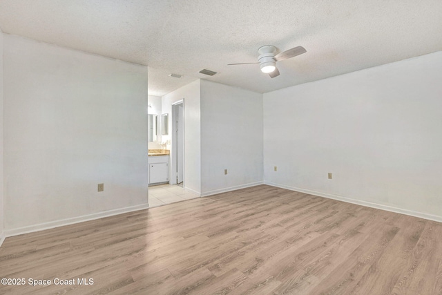1327 Canterbury Ln, Rockledge, FL 32955 - unfurnished room with light wood-type flooring, ceiling fan, and a textured ceiling