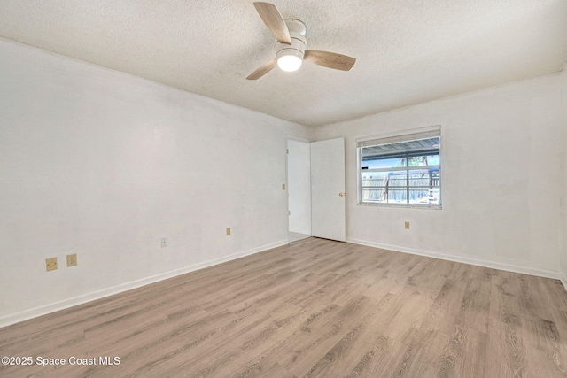 1327 Canterbury Ln, Rockledge, FL 32955 - empty room featuring wood finished floors, a textured ceiling, and a ceiling fan