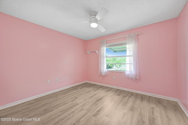 1327 Canterbury Ln, Rockledge, FL 32955 - unfurnished room with light wood-type flooring, a textured ceiling, and a ceiling fan