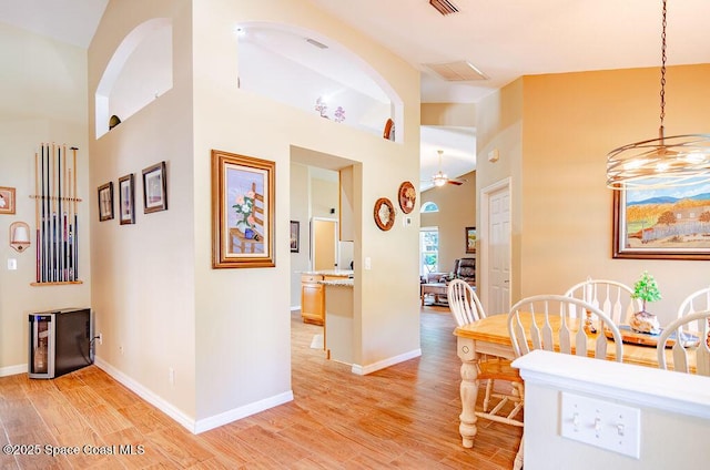 4204 Long Leaf Dr, Melbourne, FL 32940 - dining room featuring light wood-style floors, a ceiling fan, and a chandelier