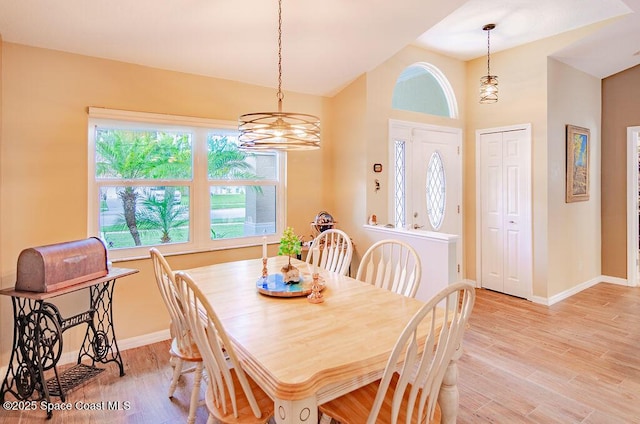 4204 Long Leaf Dr, Melbourne, FL 32940 - dining area featuring light wood finished floors, a chandelier, and lofted ceiling