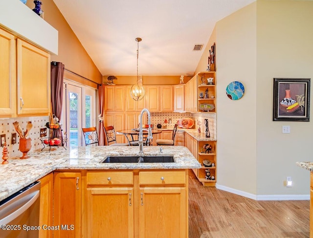 4204 Long Leaf Dr, Melbourne, FL 32940 - kitchen with dishwasher, open shelves, decorative backsplash, a peninsula, and light wood-style flooring