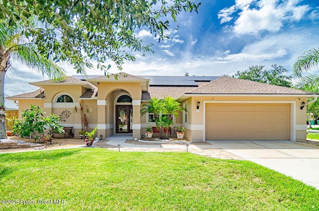 4204 Long Leaf Dr, Melbourne, FL 32940 - mediterranean / spanish-style home with stucco siding, a front yard, a garage, and driveway