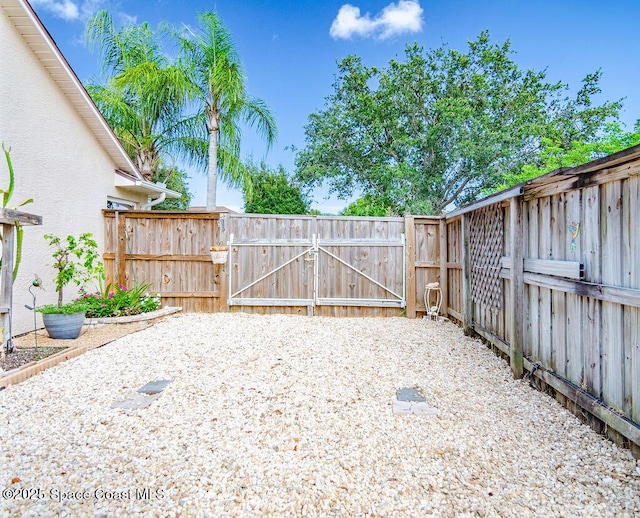 4204 Long Leaf Dr, Melbourne, FL 32940 - view of yard featuring a gate
