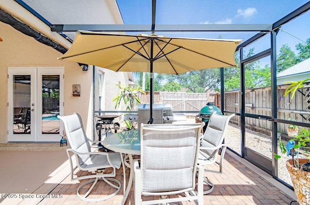4204 Long Leaf Dr, Melbourne, FL 32940 - sunroom / solarium with french doors and outdoor dining area