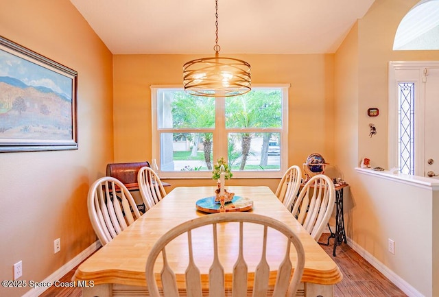 4204 Long Leaf Dr, Melbourne, FL 32940 - dining area with a chandelier and wood finished floors