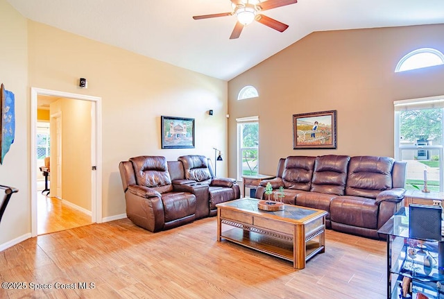4204 Long Leaf Dr, Melbourne, FL 32940 - living room with ceiling fan, high vaulted ceiling, light wood finished floors, and plenty of natural light