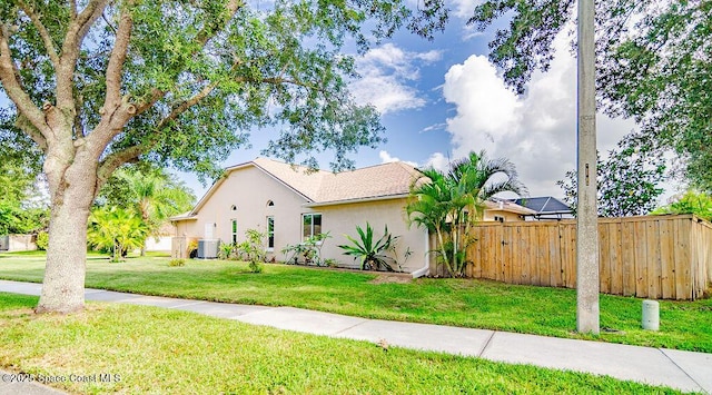 4204 Long Leaf Dr, Melbourne, FL 32940 - view of home's exterior with stucco siding and a central AC unit