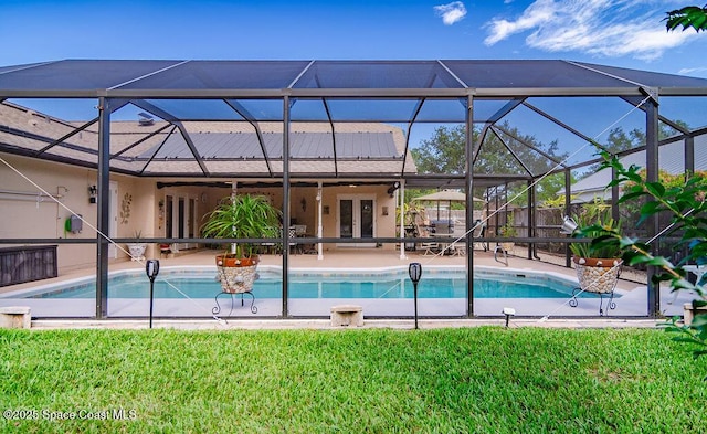 4204 Long Leaf Dr, Melbourne, FL 32940 - outdoor pool with french doors, a patio area, a lawn, and glass enclosure