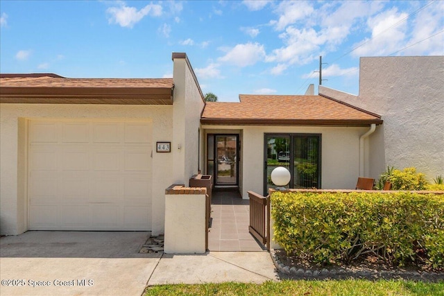 443 Hawthorne Ct, Indian Harbour Beach, FL 32937 - view of front of house with an attached garage, stucco siding, and concrete driveway