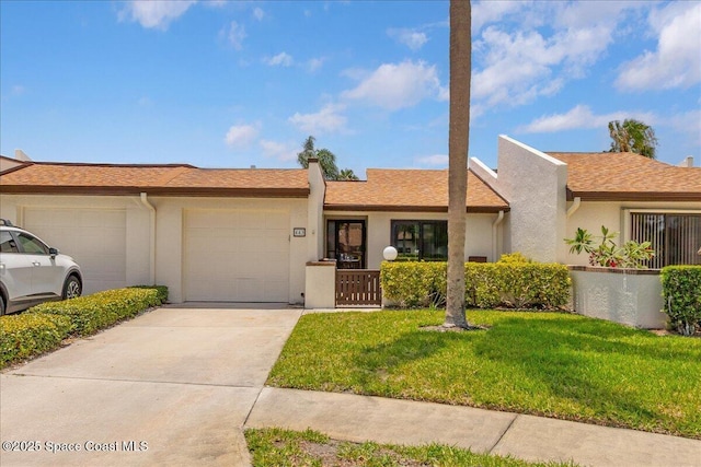 443 Hawthorne Ct, Indian Harbour Beach, FL 32937 - view of front of property with a garage, a front lawn, driveway, and stucco siding