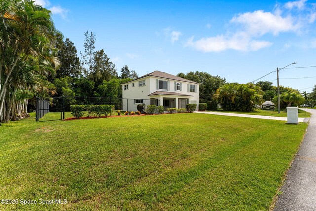 332 Nikomas Way, Melbourne Beach, FL 32951 - view of front of home with concrete driveway and stucco siding