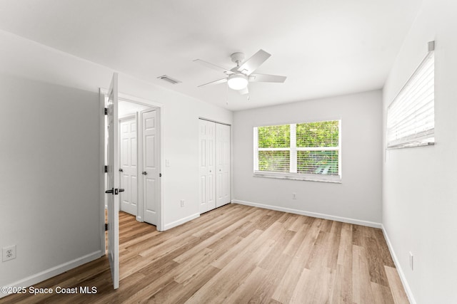 332 Nikomas Way, Melbourne Beach, FL 32951 - unfurnished bedroom with light wood-type flooring and ceiling fan