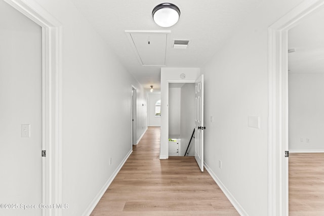 332 Nikomas Way, Melbourne Beach, FL 32951 - hall with attic access and light wood-style floors