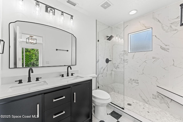 332 Nikomas Way, Melbourne Beach, FL 32951 - bathroom featuring double vanity, a marble finish shower, and recessed lighting
