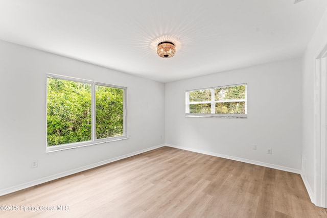 332 Nikomas Way, Melbourne Beach, FL 32951 - spare room with light wood finished floors and baseboards