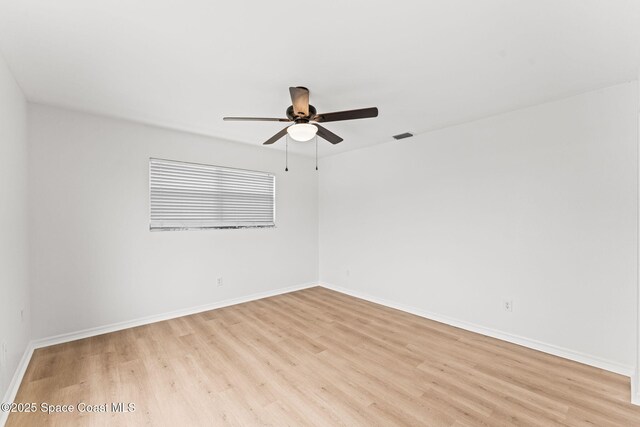 332 Nikomas Way, Melbourne Beach, FL 32951 - spare room featuring light wood finished floors and a ceiling fan