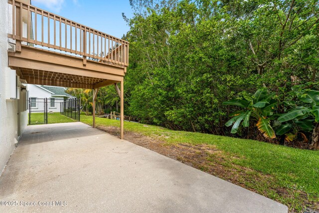 332 Nikomas Way, Melbourne Beach, FL 32951 - view of patio / terrace featuring a carport and a deck