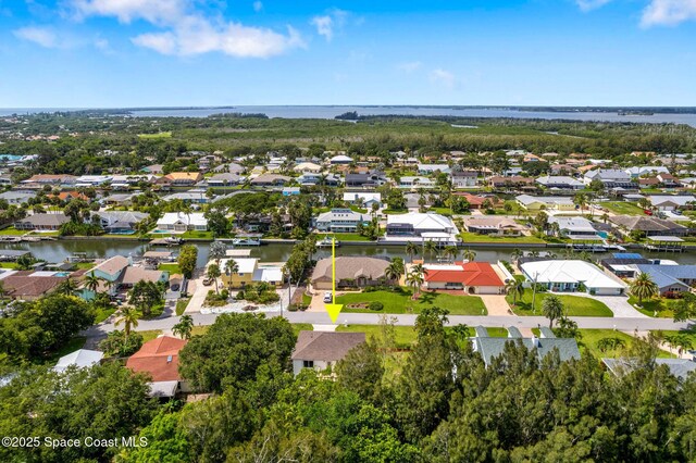 332 Nikomas Way, Melbourne Beach, FL 32951 - aerial view of property's location featuring a large body of water and nearby suburban area