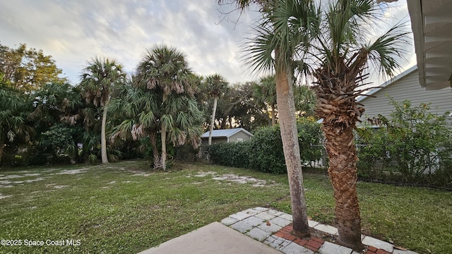 109 Fontaine St, Melbourne Beach, FL 32951 - view of green lawn with a patio area
