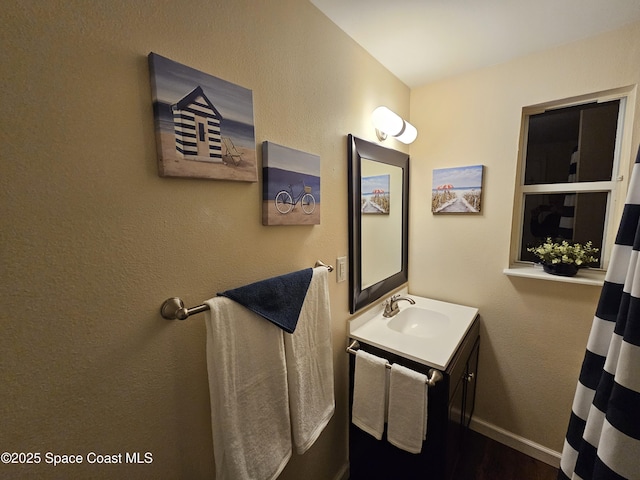 109 Fontaine St, Melbourne Beach, FL 32951 - bathroom featuring vanity and wood finished floors