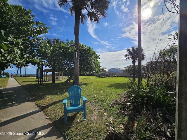 109 Fontaine St, Melbourne Beach, FL 32951 - view of grassy yard with a playground