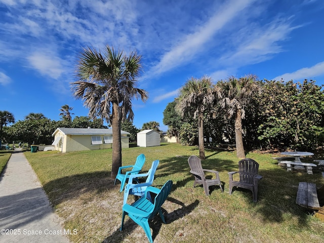 109 Fontaine St, Melbourne Beach, FL 32951 - view of grassy yard featuring a storage shed
