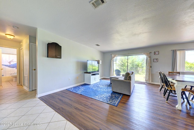 767 Adolph Ln, Cocoa, FL 32927 - living area with a textured ceiling and light wood finished floors
