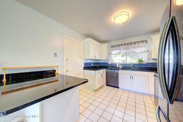 767 Adolph Ln, Cocoa, FL 32927 - kitchen featuring dishwasher, freestanding refrigerator, tasteful backsplash, and white cabinetry