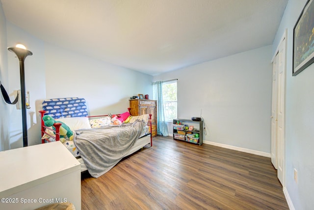 767 Adolph Ln, Cocoa, FL 32927 - bedroom with wood finished floors and baseboards