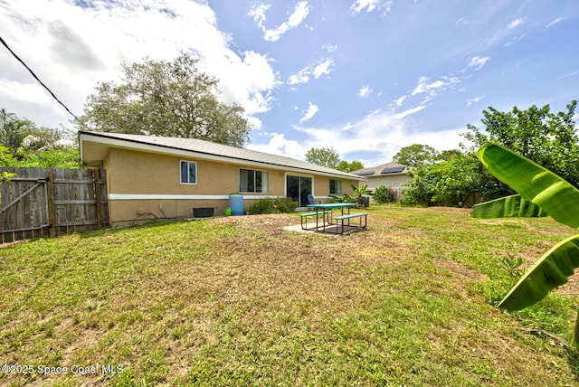 767 Adolph Ln, Cocoa, FL 32927 - rear view of property featuring stucco siding