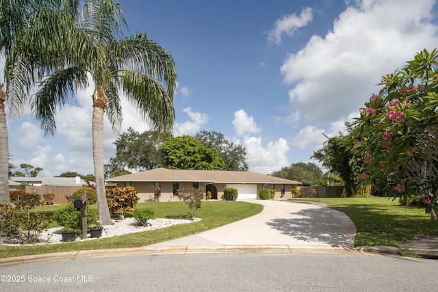 716 Endicott Rd, Melbourne, FL 32940 - ranch-style house featuring driveway, an attached garage, and stucco siding