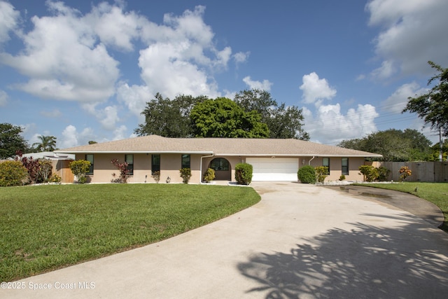 716 Endicott Rd, Melbourne, FL 32940 - single story home with concrete driveway, a garage, and stucco siding