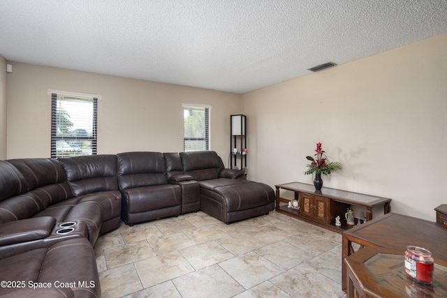 716 Endicott Rd, Melbourne, FL 32940 - living room with plenty of natural light and a textured ceiling