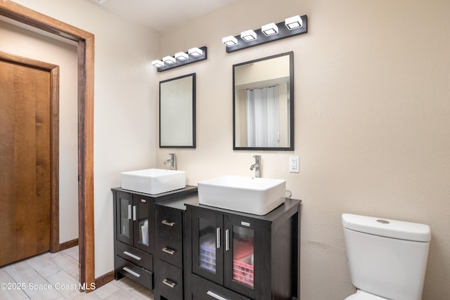 716 Endicott Rd, Melbourne, FL 32940 - bathroom with double vanity and wood finished floors
