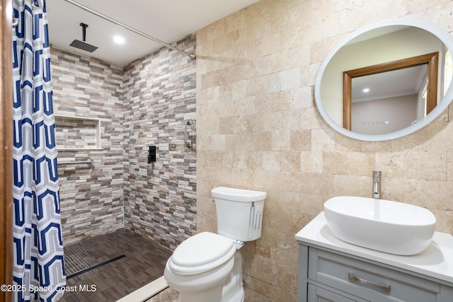 716 Endicott Rd, Melbourne, FL 32940 - bathroom with tiled shower, vanity, and recessed lighting