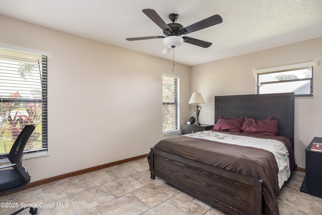 716 Endicott Rd, Melbourne, FL 32940 - bedroom featuring multiple windows, a textured ceiling, and a ceiling fan