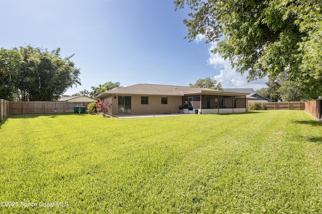 716 Endicott Rd, Melbourne, FL 32940 - rear view of house featuring a sunroom, a fenced backyard, and a patio area