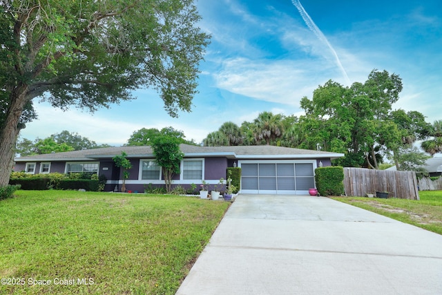 686 Joy St, Sebastian, FL 32958 - ranch-style home with concrete driveway and an attached garage