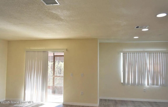 3717 Pinewood Dr NE Unit 12, Palm Bay, FL 32905 - spare room with recessed lighting and a textured ceiling