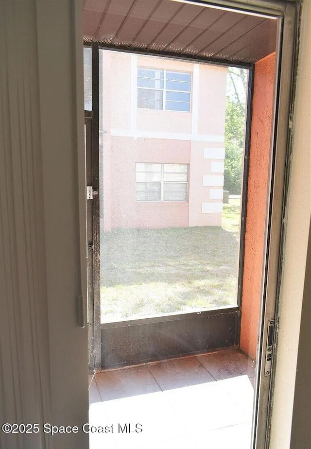 3717 Pinewood Dr NE Unit 12, Palm Bay, FL 32905 - doorway featuring tile patterned floors