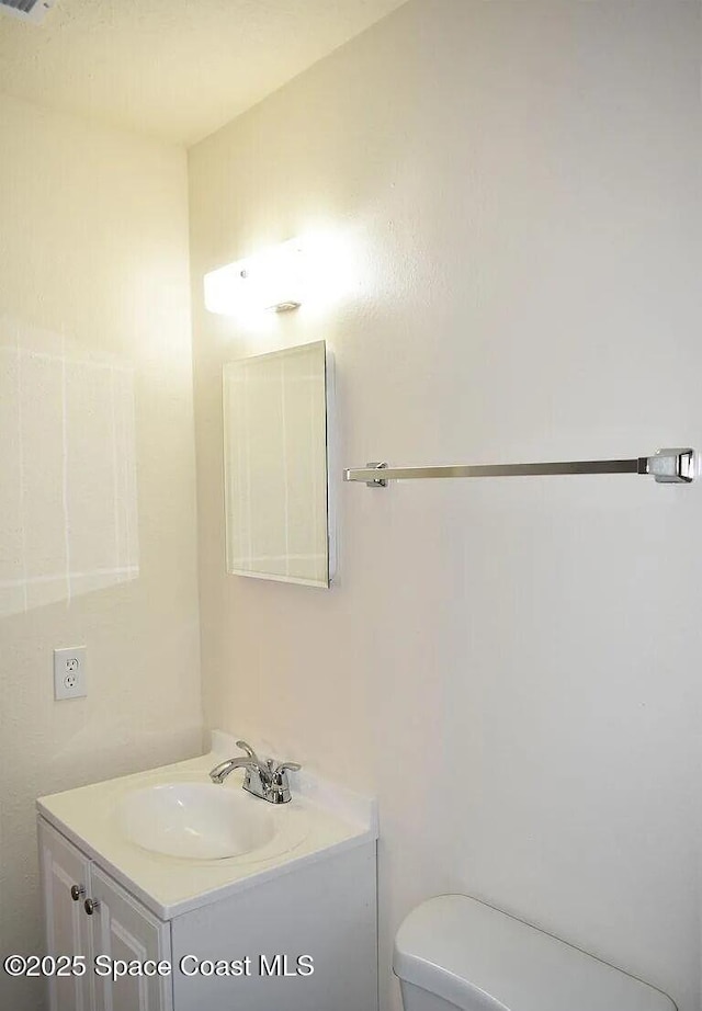 3717 Pinewood Dr NE Unit 12, Palm Bay, FL 32905 - half bathroom with vanity and toilet