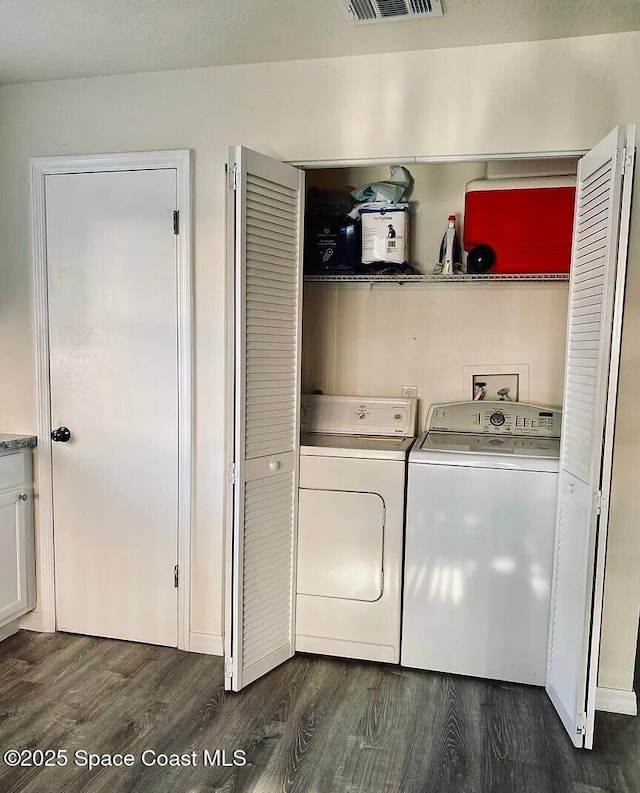 3717 Pinewood Dr NE Unit 12, Palm Bay, FL 32905 - laundry area featuring washing machine and clothes dryer and dark wood-type flooring