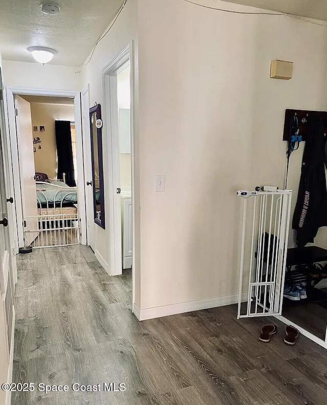 3717 Pinewood Dr NE Unit 12, Palm Bay, FL 32905 - corridor with wood finished floors and baseboards