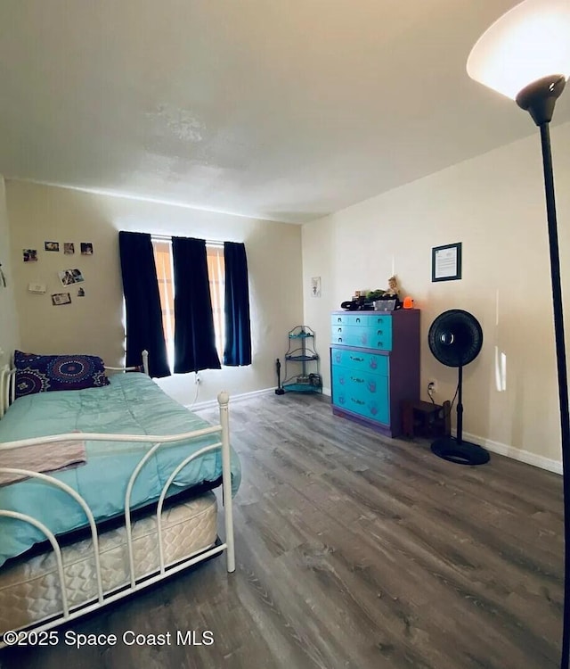 3717 Pinewood Dr NE Unit 12, Palm Bay, FL 32905 - bedroom featuring wood finished floors and baseboards