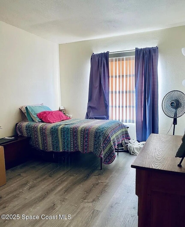 3717 Pinewood Dr NE Unit 12, Palm Bay, FL 32905 - bedroom featuring wood finished floors