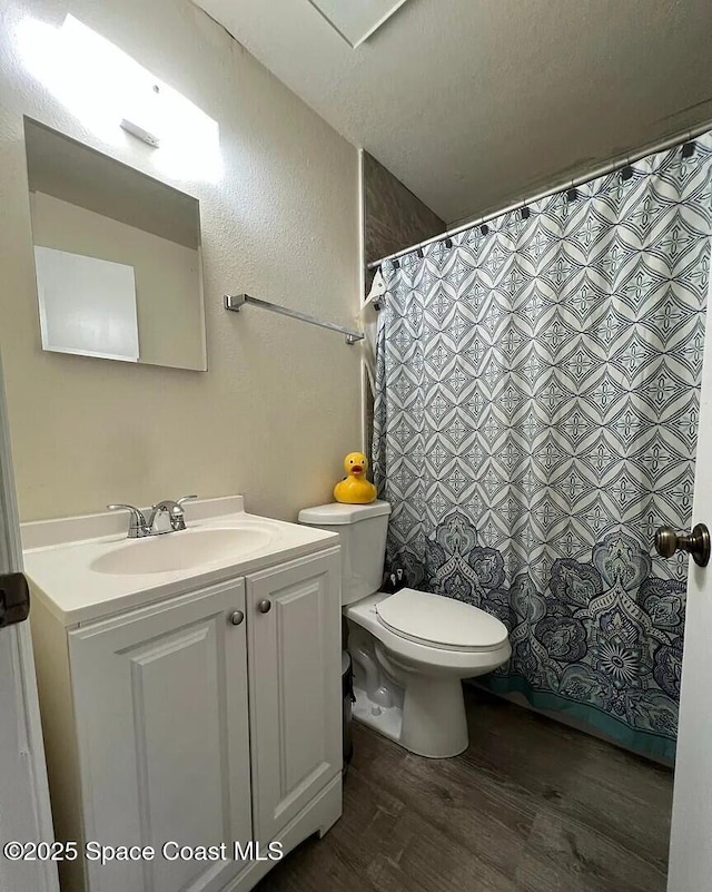 3717 Pinewood Dr NE Unit 12, Palm Bay, FL 32905 - bathroom featuring wood finished floors, vanity, and curtained shower