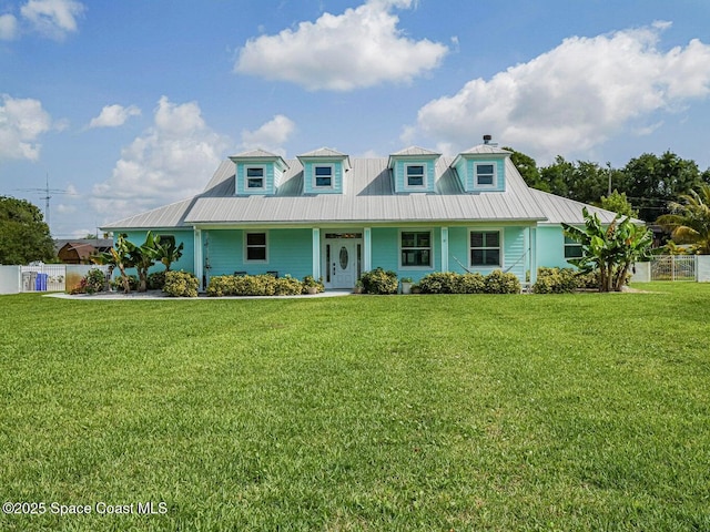 406 9th Ct, Vero Beach, FL 32962 - view of front of property with a metal roof, a chimney, and a porch