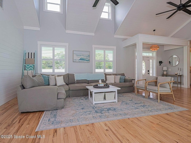 406 9th Ct, Vero Beach, FL 32962 - living area with a ceiling fan, high vaulted ceiling, healthy amount of natural light, and wood finished floors