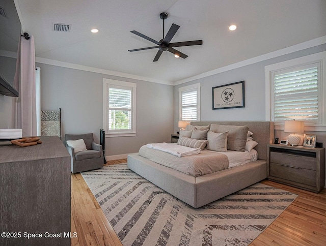 406 9th Ct, Vero Beach, FL 32962 - bedroom with crown molding, wood finished floors, recessed lighting, ceiling fan, and vaulted ceiling